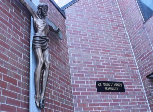 <p>A crucifix statue sits outside of St. John Vianney Seminary on St. Thomas' north campus. Both SJV and the St. Paul Seminary and School of Divinity will remain unchanged under the leadership of Julie Sullivan. (Gabrielle Martinson/TommieMedia)</p> 