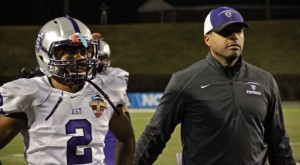 Cornerback Chinni Oji and running backs coach Emmett Hill share a somber moment as they exit the Stagg Bowl Dec. 14, 2012. Oji is one of many senior athletes who finished the final season of their college careers. (Rosie Murphy/TommieMedia)