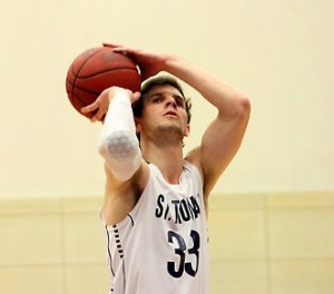 Forward Zach Riedeman shoots a free throw against Carleton during the regular season. Riedeman will be a key returner for the St. Thomas men's basketball team next season. (Rosie Murphy/TommieMedia)