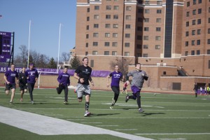 The track and field teams practice outside after being confined to the Anderson Student Center during their indoor season. Both teams have high aspirations for winning the conference championship. (Alex Goering/TommieMedia)