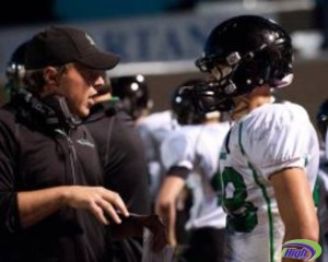 Tony Danna gives advice to a Hill Murray player last season. Danna was Hill Murray's defensive coordinator, but has been promoted to head coach following the resignation of former head coach Mark Mauer. (Courtesy of ____)
