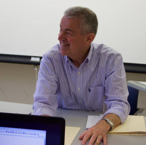 Psychology Professor John Buri laughs during lecture. Buri has worked at St. Thomas longer than any other professor, with 39 years of service to the university. (Meghan Vosbeek/TommieMedia) 