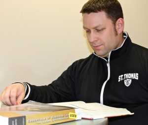 unners' Mate Second Class Timothy Potter studies his accounting textbook. The Accounting Club on campus has allowed Potter to connect with students outside of the military. (Eden Checkol/TommieMedia)