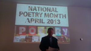 Library Director Dan Gjelten opens the "Poetry in the Parlor" event with a piece by W.S. Merwin. The library hosted 12 readers expressing some of their favorite poems. (Alex Goering/TommieMedia)