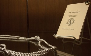 The Delta Epsilon Sigma handbook and the tassel members wear at graduation sit in a case in the John Roach Center. DES will no longer offer students free classes beyond 16 credits after the 2013-2014 school year. (Gabrielle Martinson/TommieMedia)