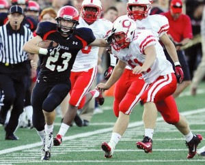 Football recruit Derek Soderberg rushes against Centennial defenders. Soderberg is an asset on both sides of the ball, ranked second as a defensive back by MaxPreps.com (Photo courtesy of Brian Nelson)