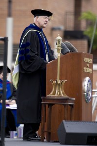 The Rev. Dennis Dease addresses the class of 2013 and its guests at Saturday's undergraduate commencement ceremony. The university awarded Dease with a Doctor of Humane Letters honorary degree for his 22 years with the institution. (Rita Kovtun/TommieMedia)