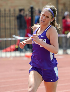 Taylor Berg makes her way to the finish line in the 5,000 meter run during the MIAC track and field championships May 11. Berg finished second in the 5,000 meter run in the NCAA championships Saturday. (Whitney Abrahamson/TommieMedia)