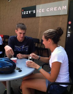 Macalester students Logan Hovie and Sarah Jonathan enjoy a scoop of Izzy's Ice Cream on a hot September day. Izzy's Ice Cream is opening a location in The Loft at St. Thomas in mid-September. (Molly Sigler/TommieMedia) 