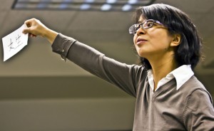 Mandarin Chinese Professor Xi He holds up flashcards during her class. The new class, CHIN111, is the first of a series of Mandarin Chinese courses now offered at St. Thomas. (Eric Wuebben/TommieMedia)