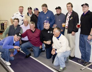 Members of the 1973 MIAC football championship team reunite in the beer garden at Purple on the Plaza, which was relocated to the Anderson Athletic and Recreation Complex field house because of a threat of rain. (Paige Johnson/TommieMedia) 