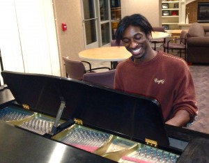 Junior Christlo Gittens practices piano in the Flynn Hall lobby. Gittens was told that his musical capabilities may be used during the "Haunted Tactics" series. (Kayla Bengtson/TommieMedia)  