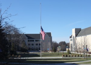 The American Flag in the Lower Quad flies at half-staff in honor of the 50th anniversary of the assassination of President John F. Kennedy. Students, faculty and staff reflected on the infamous event. (Grace Pastoor/TommieMedia) 