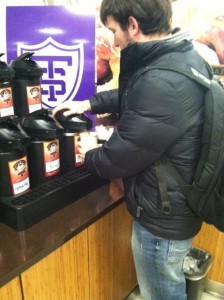 Senior Alex Johnson pours a cup of Alakef coffee in the Summit Marketplace. Starbucks has been replaced by local, fair trade coffees such as Alakef and Peace Coffees. (Michelle Doeden/TommieMedia)