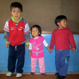 Three children play in Casa Cuna, one of the Working Boys Center's daycares. The organization serves about 2,000 people in Quito, Ecuador every day, according to its website. (Photo courtesy of Abby Anderson)