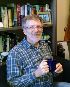 Tim Lewis, chair of the biology department at St. Thomas, sits in his office. Lewis will step down as chair this June and remain with the university as a professor. (Lauren Schaffran/TommieMedia)