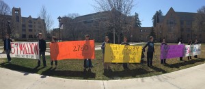 Students display signs to raise pro-life awareness during Thursday as part of "Save the Humans Week." The week's events   ranged from speakers to a spiritual adoption retreat. (Margaret Galush/TommieMedia)