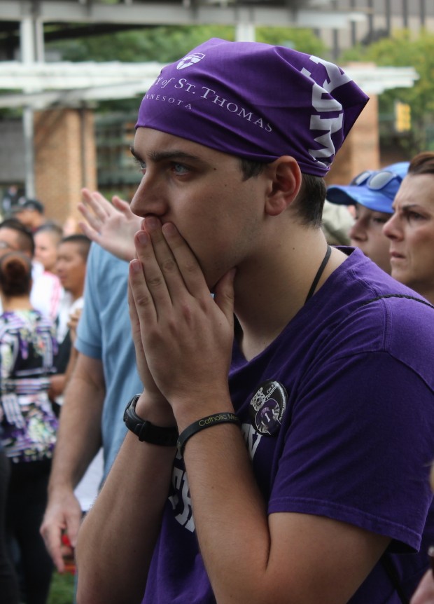 St. Thomas student Robert Klemm waits with the faithful for Pope Francis in Philadelphia Saturday. Klemm and hundreds of others watched a live feed of the pope arriving. (Grace Pastoor/TommieMedia)  