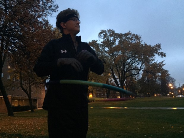 Sophomore Ryan Smith displays his hula-hooping skills. Smith started hula-hooping on the upper quad as a way to lose weight. (Noura Elmanssy/TommieMedia)