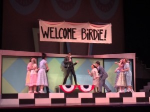 The cast comes together during one of the musical numbers of "Bye Bye Birdie." To put on the show, students put in roughly 20 hours of rehearsal each week since February. (Margaret Galush/TommieMedia)