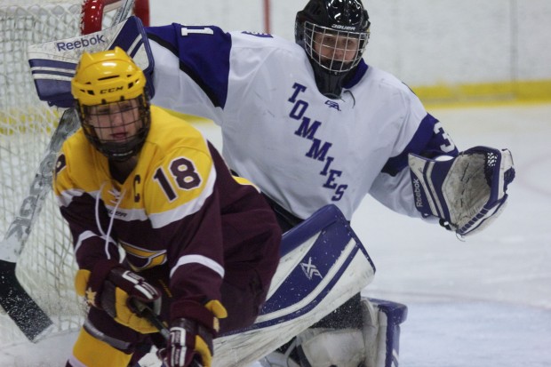 St. Thomas goalie Kenzie Torpy slides across the crease to deny any Concorida-Moorhead scoring chance in the first period. Torpy stopped 25 Cobber shots in the Tommies' 2-1 victory Saturday afternoon. (Jesse Krull/TommieMedia) 