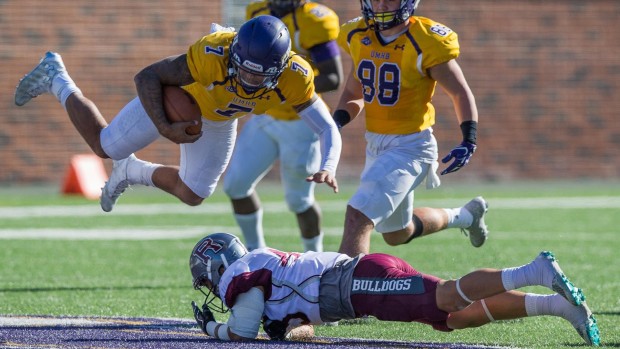 Mary Hardin-Baylor quarterback Blake Jackson dives into the endzone from 6 yards out to score Saturday against Redlands in the first round of the NCAA Division III playoffs. The top-ranked Crusaders won 50-28. (http://www.cruathletics.com/)