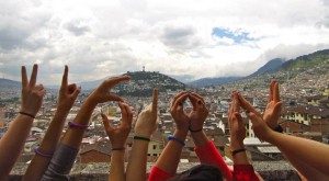 St. Thomas students on a VISION trip to Quito, Ecuador spell out the program's name with their hands on top of the Basilica del Voto Nacional in January 2013. VISION will add three new Catholic-focused trips this spring break. (Photo courtesy of Kelsey Whitecotton) 