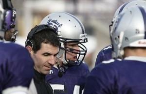 <p>Caruso speaks with players during Saturday's game. (John Kruger/TommieMedia)</p>