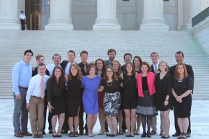 Catholic Studies Leadership Interns stand on the steps of the United States Supreme Court Building. 