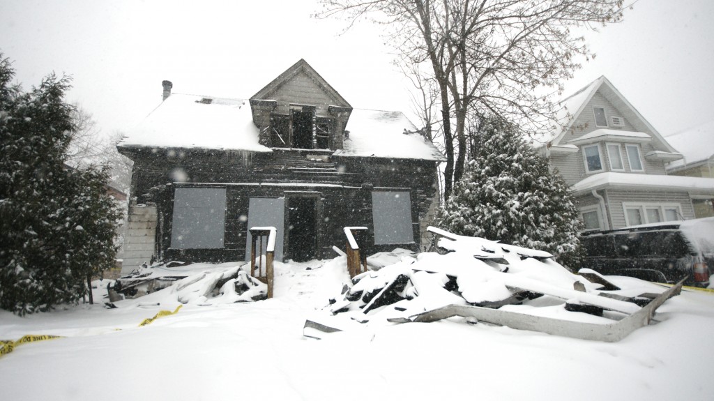 <p>The house, located at 1795 Selby Ave., was engulfed in flames when firefighters arrived. (John Kruger/TommieMedia)</p>
