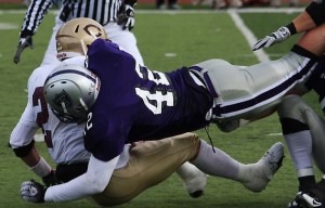 <p>Senior Wyatt Delgado sacks Concordia quarterback Andrew Larson in last years game. (Marc Lane/TommieMedia)</p>