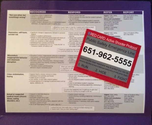 At the all staff forum last Tuesday, staff members were given purple folders containing guidance on how to recognize, respond, refer and report in the event of a crisis. Red cards labeled Active Shooter Protocol, were also distributed with the Public Safety emergency line and a list of three steps to follow: run, hide and fight. (Margaret Galush/TommieMedia) 