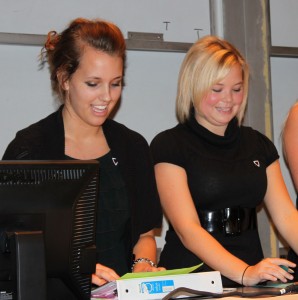 Gamma Service Vice President Alex Martynec and Service Assistant Malorie Schmidt discuss volunteer opportunities during Gamma Sigma Sigma's initiation. (Cynthia Johnson/TommieMedia)