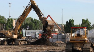 Construction crews move dirt at the future location of the Anderson Student Center. (Michael Ewen/TommieMedia)