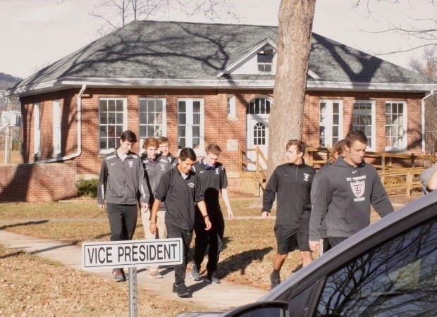 The men's soccer team departs a HopeTree house after socializing with guests for an hour.  (Peter Monahan/TommieMedia) 