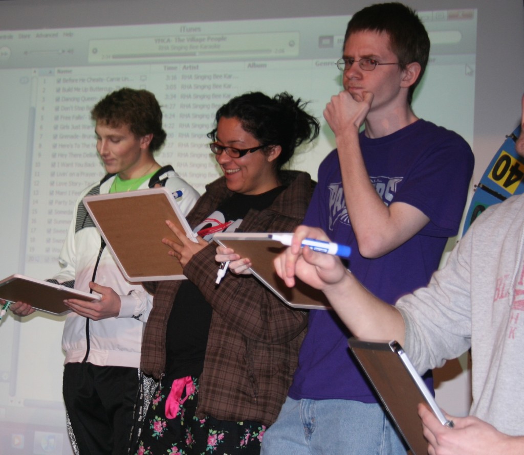 <p>Students try to guess the name of a song Monday night at the Residence Hall Association's Singing Bee. (Drew Landon/TommieMedia)</p>