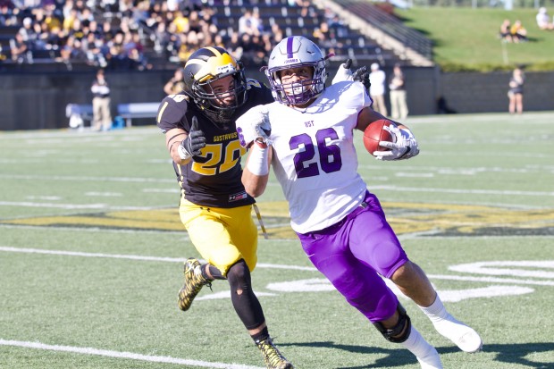 Running back Josh Parks dodges a Gustie defensive back. Parks recorded his seventh touchdown of the season in the first half. (Meghan Vosbeek/TommieMedia)