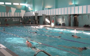 <p>As part of their tapering regiment before the championships, the men's team swims laps in McCarthy Gym on South Campus. (Ashley Bolkcom/TommieMedia)</p>