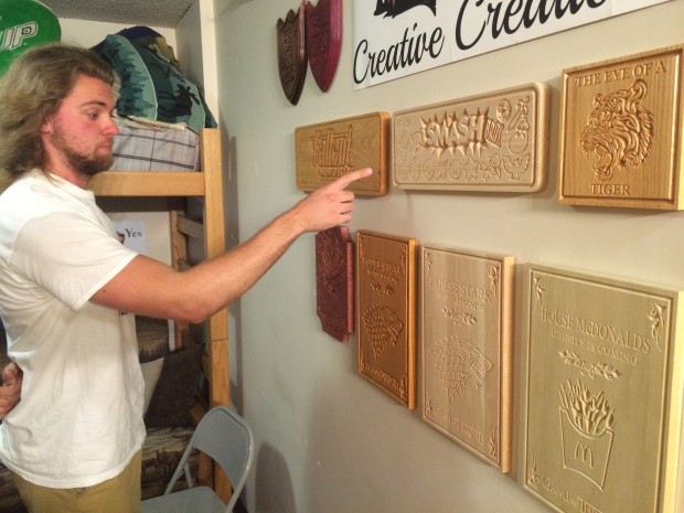 Luecke explains the process for making his signs. Each sign took about a day to make. (Noah Brown/TommieMedia)  