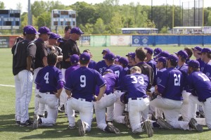 Coach Chris Olean holds a team huddle after St. Thomas' 10-5 loss to St. John's in the MIAC Championship. The Tommies hope to receive an at-large bid to the NCAA tournament with their 34-8 overall record. (Hayley Schnell/TommieMedia)