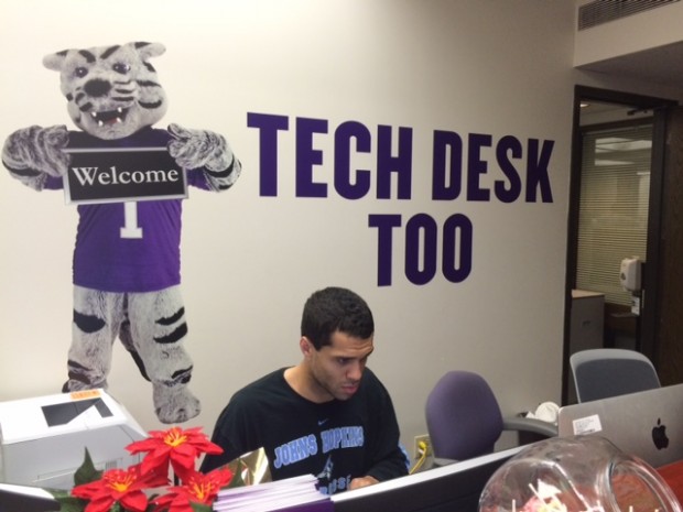 A student works at the ITS desk in the lower level of OEC. ITS has taken advantage of the summer lull and made many tech changes around campus. 