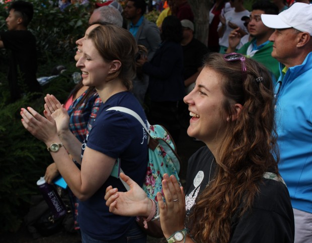 Tommie junior Madeline Shogren (right) and graduate school student Christine Skalko (left) clap as Pope Francis finishes his speech. The pope spoke Saturday about tolerance and inclusion. (Grace Pastoor/TommieMedia.) 