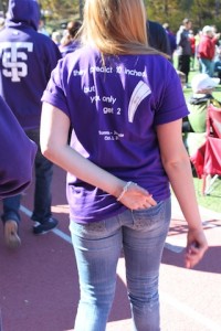 A student is shown wearing a Tommie-Johnnie T-shirt at last year's game. (John Kruger/TommieMedia)