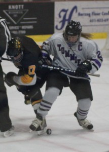 Senior captian Kelley Fallen skates past a Gustavus defender. (Rebecca Omastiak/TommieMedia)