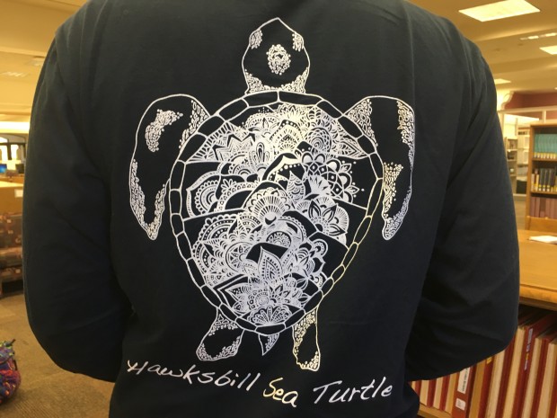 RHEA currently offers two styles of t-shirts, the Hawksbill Sea Turtle and the Sumatran Tiger. RHEA was started by Katherine Bernal on Nov. 1. (Lydia Lockwood/TommieMedia) 