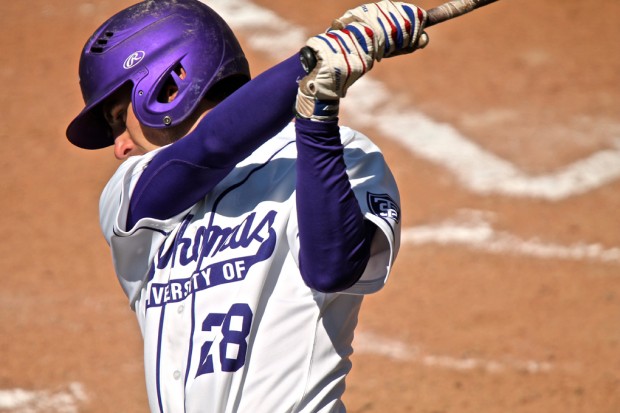 Outfielder Jake Smith follows through on a swing in a game against Bethel. The Tommies lost both games in their doubleheader against St. Scholastica Sunday. (Carlee Hackl/TommieMedia) 