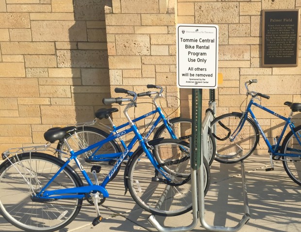 Bikes offered by St. Thomas are parked in racks on campus. TommieCentral began offering students, faculty and staff free bike rentals after the university's partnership with Nice Ride ended. (Claire Noack/TommieMedia)