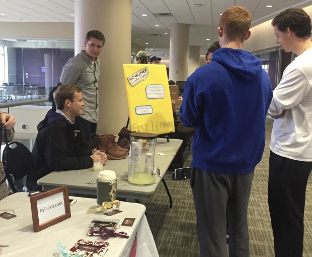 St. Thomas students look at the final products made by Entrepreneurship 200 students. The course allows students to create a brand and launch their own business. (Claire Noack/TommieMedia) 