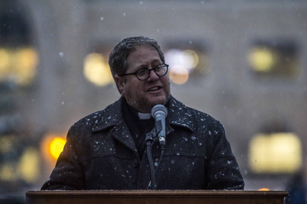 The Rev. Erich Rutten, director of Campus Ministry addresses the crowd at December's tree-lighting ceremony. Rutten will leave St. Thomas at the end of May. (Andrew Brinkmann/TommieMedia)  