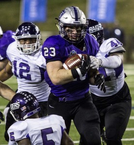 Running back Jordan Roberts breaks away from a group of Mount Union tacklers in the 2015 Stagg Bowl. Roberts became the first Tommie back to surpass 2,000 yards in a season this year and was named the d3football.com Offensive Player of the Year. (Andrew Brinkmann/TommieMedia) 